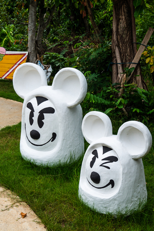 LAMPHUN, THAILAND - July 12, 2015 : Mickey mouse statue on grass floor, Thailand.のeditorial素材
