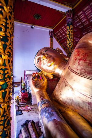 Reclining Buddha in Pong Sanuk temple, Lampang province.の写真素材