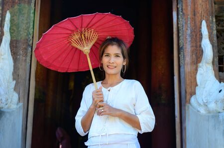 Thai woman with Lanna style background, Chiang Mai.の写真素材