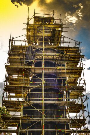 Big Standing Buddha under renovation in  Analyo Thipayaram temple, Thailand.