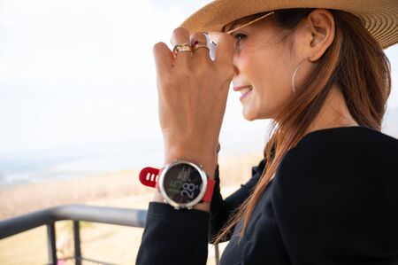 Asian woman with sunglasses on tower, Lampang province.の写真素材