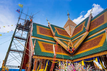 The ceremony of mounting the gable-finial at Phrathat San Don temple, Lampang province.のeditorial素材