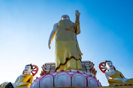 Standing Buddha statue of Phra That Doi Kham temple, Chiang Mai province.の写真素材