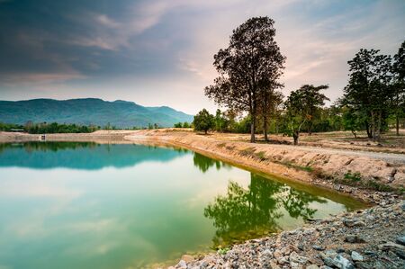 Reservoir with mountain view at evening, Chiang Mai province.