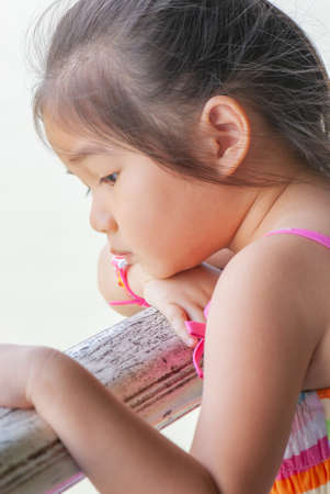 Asian little girl is looking, Thailand.