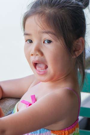 Asian little girl is looking, Thailand.