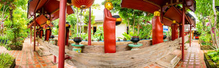 CHIANG RAI, THAILAND - July 18, 2020 : Wooden Monk Statue in Phra That Mae Chedi Temple, Chiang Rai province.のeditorial素材