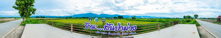PHAYAO, THAILAND - July 20, 2020 : Panorama View of Rice Field at San Pa Muang Village, Thailand.