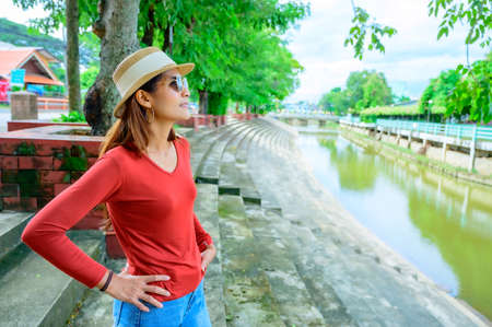 Asian woman at park in Chiang Kham district, Phayao province.