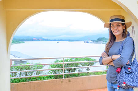 Asia Woman Traveler with Golden Triangle Background, Chiang Rai Province.の写真素材