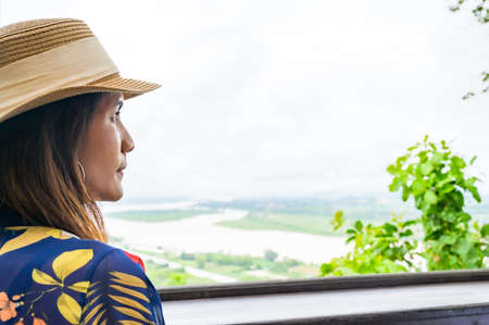 A Woman Traveler with White Sky Background at Chiang Saen District, Chiang Rai Province.の写真素材