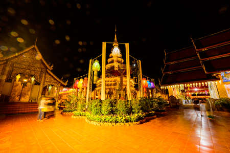 LAMPHUN, THAILAND - October 28, 2020 : Phra That Hariphunchai Pagoda with Lanna Style Lantern at Night, Lamphun Province.のeditorial素材