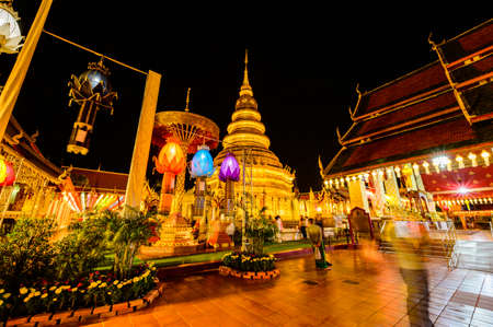 LAMPHUN, THAILAND - October 28, 2020 : Phra That Hariphunchai Pagoda with Lanna Style Lantern at Night, Lamphun Province.のeditorial素材