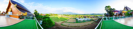 NAN, THAILAND - November 4, 2020 : Panorama View of Thai Style Building and Rice Fied at Si Mongkol Temple, Nan Province.のeditorial素材