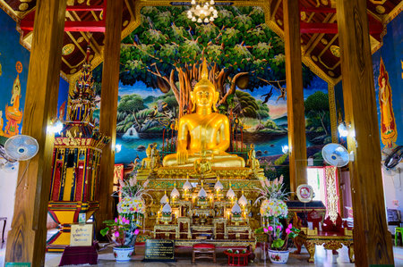 NAN, THAILAND - November 5, 2020 : Old Buddha Statue with Thai Style Church in Prang Temple, Nan Province.のeditorial素材