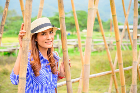 Thai Girl in Blue Dress with Park Background, Nan Province.の写真素材