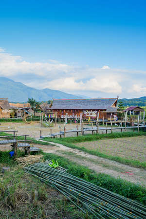 NAN, THAILAND - November 4, 2020 : Panorama View of Thai Style Building and Rice Fied at Si Mongkol Temple, Nan Province.のeditorial素材