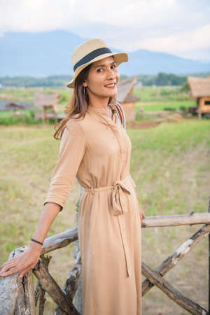 Asian Woman in Rice Field at Si Mongkol Temple, Nan Province.の写真素材