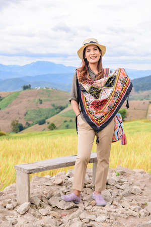 Asian Woman with Rice Field Background at Pa Bong Piang Rice Terraces, Chiangmai Province.の写真素材