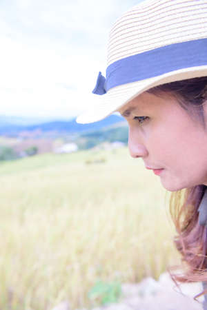 Face of Asian Woman with Rice Field Background at Pa Bong Piang Rice Terraces, Chiangmai Province.の写真素材