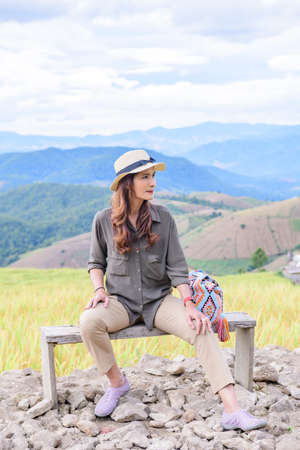 Asian Woman with Rice Field Background at Pa Bong Piang Rice Terraces, Chiangmai Province.の写真素材