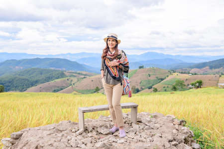 Asian Woman with Rice Field Background at Pa Bong Piang Rice Terraces, Chiangmai Province.の写真素材