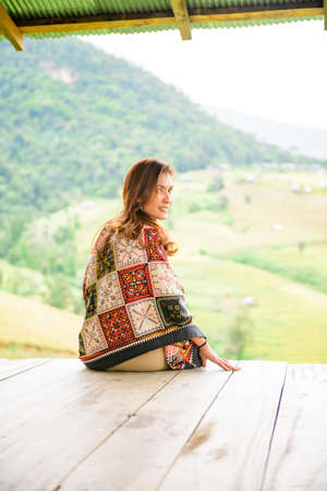 Asian Woman in Thai Native Pavilion with Rice Field Background at Pa Bong Piang Rice Terraces, Chiangmai Province.の写真素材