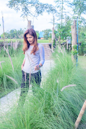 Asian Woman in Park at Phayao Province, Thailand.の写真素材