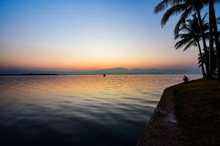 Kwan Phayao Lake with Motion Blurred Water at Evening, Thailand.の写真素材