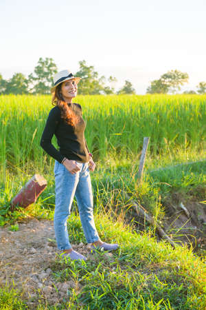Thai Female with Rice Field Background, Phayao Province.の写真素材