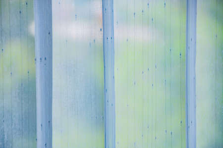 White sheer curtains hanging on the window, Thailand.の写真素材