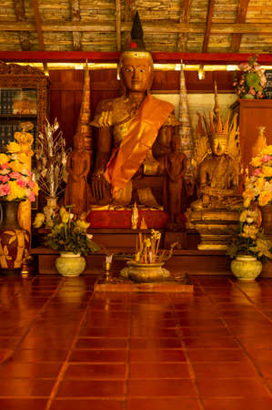 Wooden Buddha Statue in Old Pavilion at Wat Luang Khun Win, Chiangmai Province.のeditorial素材
