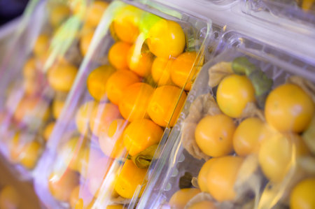 Cape gooseberries in plastic boxes on a fruit stand at Chiang Mai Province, Thailand.