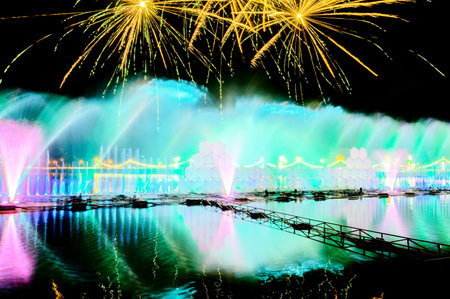 Chiang Mai Series : Dancing fountain and fireworks show in the lake at Chiangmai. Festive atmosphere and beautiful lights during Christmas celebration. Celebrations during the New Year Festival.の写真素材