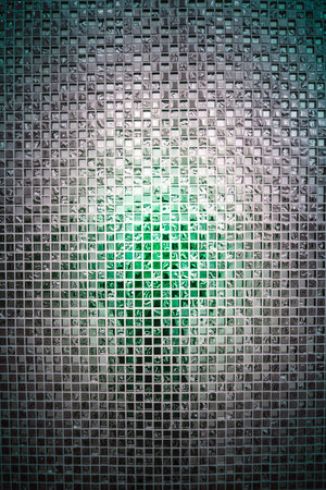 Background Series : Mosaic tile wall with mirror surface. Seamless silver glass mosaic texture. Walls decorated with mirrors. Reflective silver wall. Glass wall background.の写真素材