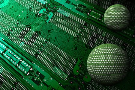 two spheres on electronic scheme green backgroundの写真素材
