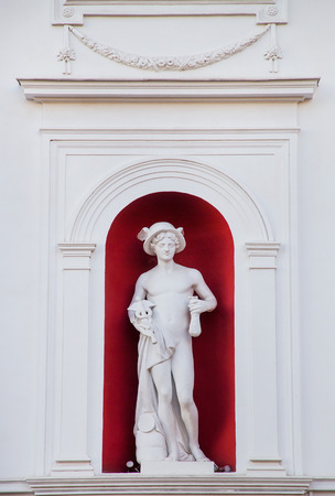 statue on the facade of city hall in Odessa Ukraineの写真素材