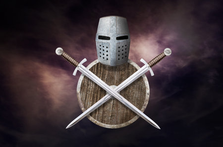 knight's helmet shield and two swords on dark backgroundの写真素材