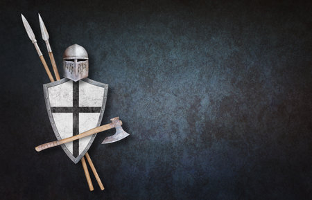 knight's helmet axe white shield with black cross and two spears on blue grunge backgroundの写真素材