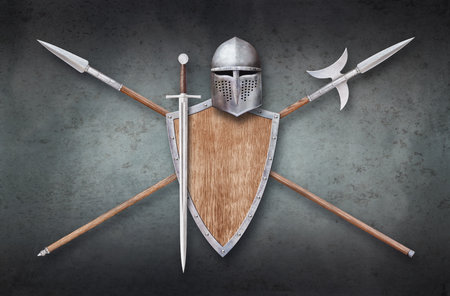 knight's helmet wooden shield sword and two crossed lances on grunge backgroundの写真素材