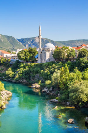 mosque near Neretva river in Mostar in Bosnia and Herzegovinaの写真素材