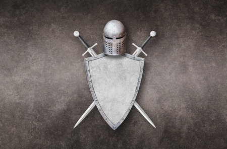 knight helmet metal shield and two swords on grunge backgroundの写真素材