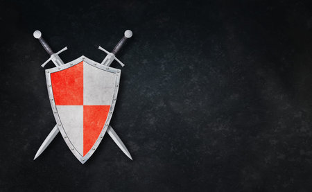 knight shield and two crossed swords on grunge backgroundの写真素材