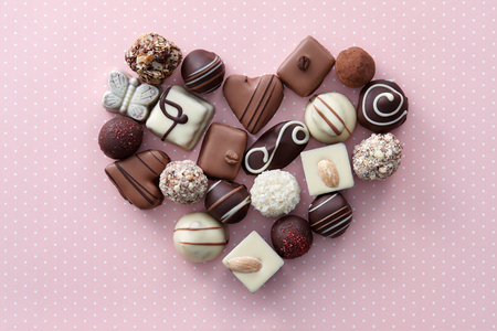 Chocolate candies heart shape composition. Sweet gift of love for St. Valentines Day.の写真素材
