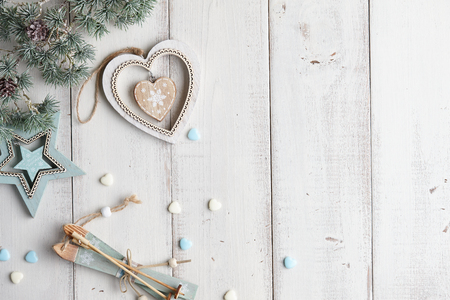 Christmas background with decorations and gifts on white boardsの写真素材