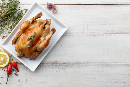 Roasted chicken with herbs and spices for Christmas or Thanksgiving holiday dinner, top viewの写真素材