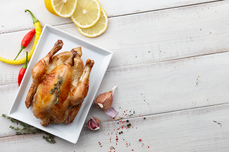 Roasted chicken with herbs and spices for Christmas or Thanksgiving holiday dinner, top viewの写真素材