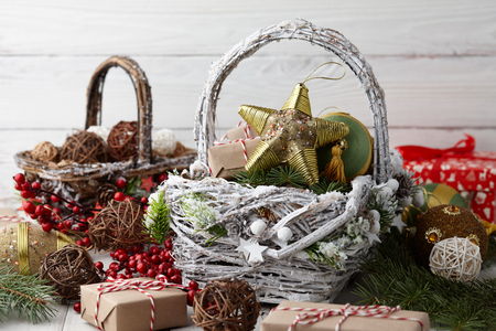 Christmas decorations baskets on white planksの写真素材