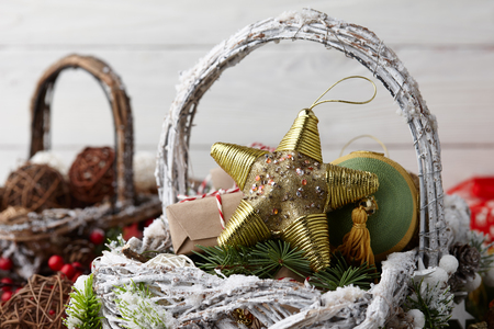 Christmas decorations baskets on white planksの写真素材