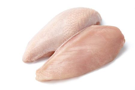 Raw chicken fillet with and without skin isolated on white backgroundの写真素材